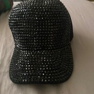 Brand new; black charmed cap.